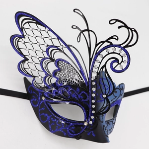 Detailed view of luxury laser-cut blue butterfly mask with rhinestones and glitter finish