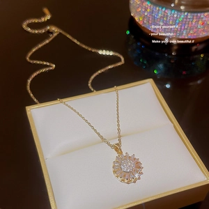 Luxury gold sunflower pendant necklace with white cubic zirconia in a jewelry gift box