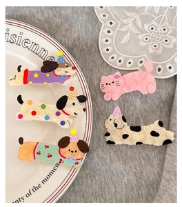 Detailed view of five colorful acetate cartoon animal hair clips for girls on a lace coaster
