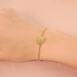 Adjustable gold monstera leaf bracelet featuring a minimalist box chain for women