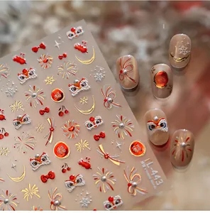 Detailed view of Lunar New Year nail stickers with lion dance and golden firework motifs