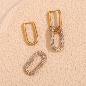 Macro view of gold plated oval hoop earrings with shimmering micro-pave white zircons