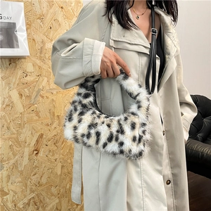Chic leopard print plush crescent handbag with black leather strap for autumn fashion