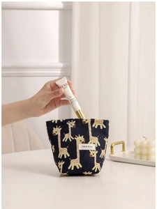 Navy blue canvas pouch with giraffe pattern for cosmetics and daily essentials