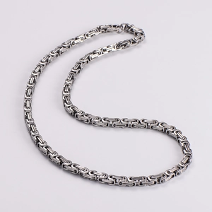 Close-up of 6mm stainless steel Byzantine chain necklace with silver polished finish