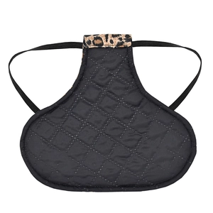 Detailed view of leopard print chicken saddle with quilted fabric and elastic straps