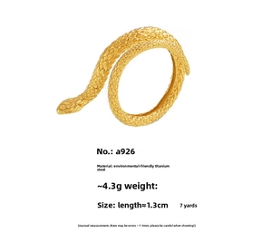 Detailed view of the 18K gold plated snake-scale texture on a titanium steel ring