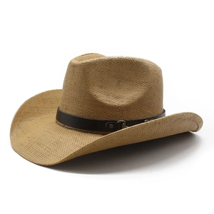 Detail of woven straw cowboy hat with brown leather band and bronze metal buckle