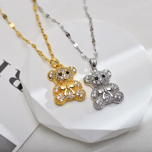 Sparkling bear pendant necklace set with zircon stones in gold and silver finish