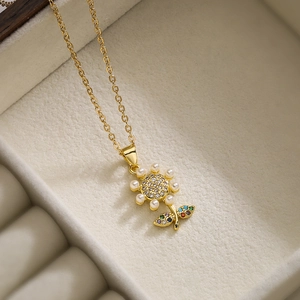 18K gold plated sunflower necklace with pearls and zircons in a beige jewelry box