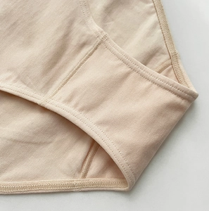 Detail of double-layer cotton crotch lining and fine stitching on beige sports panties