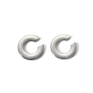 Detailed view of silver-tone C-shape stainless steel earrings with high-polished finish
