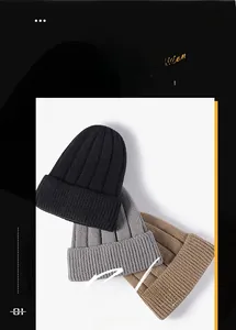 Close-up of ribbed knit beanies in black, grey and khaki with warm textured detail
