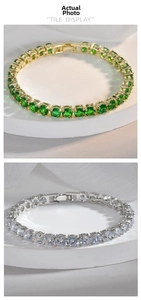 Macro view of emerald and clear round zircon tennis bracelets with 18k gold plating