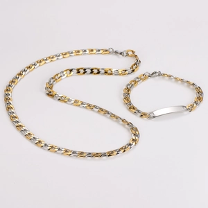 Detailed shot of two-tone Figaro chain necklace and bracelet set with blank ID nameplate