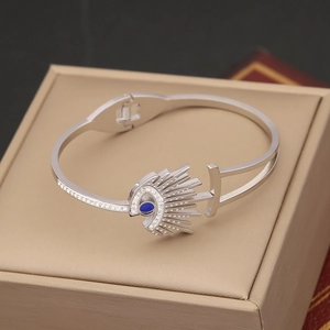 Adjustable silver evil eye cuff bracelet with blue gemstone and white zircon accents