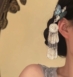 Detailed close-up of blue resin butterfly hair clip with elegant long silver tassels for Hanfu