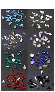 Macro view of multi-color 3D nail art rhinestones in heart, moon, and star shapes