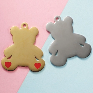 Polished teddy bear charms in gold with red hearts and silver stainless steel finish