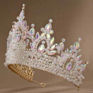 Detail of pink rhinestones and iridescent crystals on a vintage gold baroque tiara