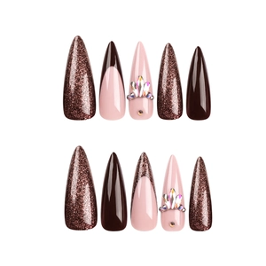 Long stiletto press-on nails in mocha brown and glitter with rhinestones and french tips