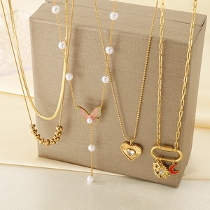 Layered 18K gold-plated stainless steel necklaces with butterfly and heart charms