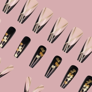 Long ballet press-on nails with black gold French stripes and autumn maple leaf patterns