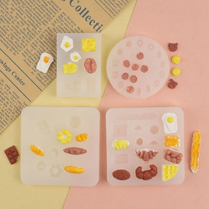 Macro view of mini silicone molds with miniature waffles, donuts, and chocolate shapes
