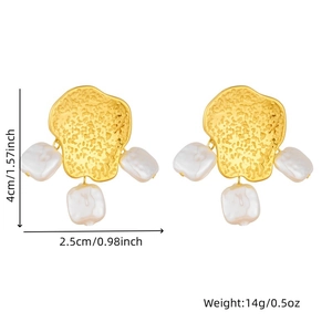 Detail of hammered gold earrings with irregular pearls and size measurements in inches