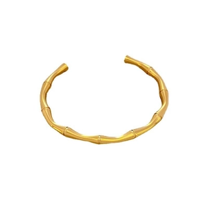 Minimalist gold titanium steel cuff bracelet with a vintage bamboo joint design