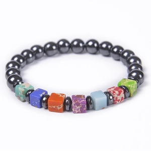 Macro detail of elastic bead bracelet with colorful square stones and metallic beads