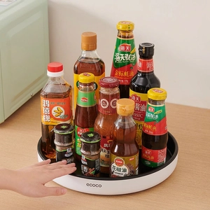 Rotating kitchen spice rack organizer with 360-degree swivel for condiment storage