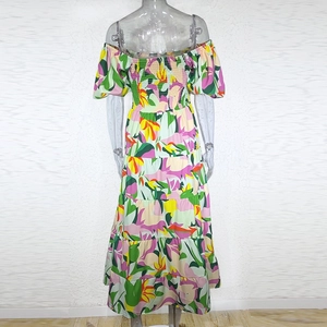 Detail of floral off-shoulder maxi dress with puff sleeves and layered cake skirt