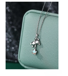 Close-up of S925 silver necklace featuring a mirror-polished bear and iridescent star