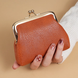 Vintage caramel brown leather mini coin purse with golden metal clasp closure