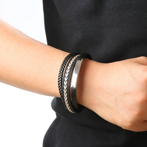 Men's multilayer black braided leather bracelet with a polished silver metal plate detail