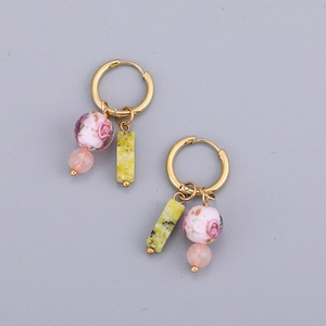 Detail of gold hoops with pink rose beads and green marble stone rectangular pendants