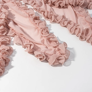 Close-up of pink tiered ruffle detail on lightweight chiffon vacation style set
