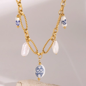 18k gold stainless steel necklace with white pearls and blue floral ceramic heart pendant