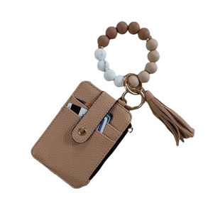 Beaded silicone keychain bracelet with khaki leather card holder and tassel charm