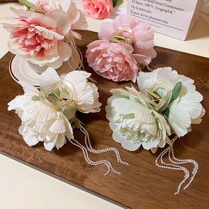 Floral hair claw clip with cascading rhinestone tassels in various pastel colors