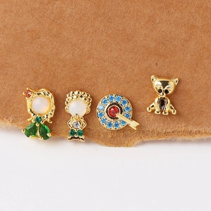 Whimsical gold earrings set with colorful zircons featuring princess and bear designs