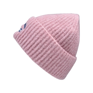 Detail of pink ribbed knit beanie featuring soft yarn texture and a blue woven side label