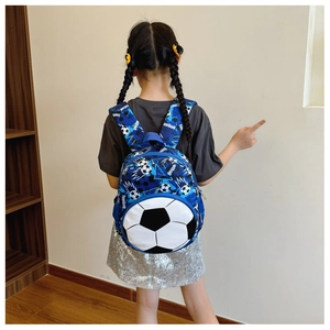 Blue camouflage football backpack for kids shown on child for size and fit
