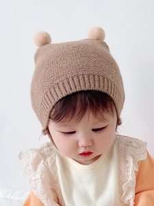 Cute baby winter knit hat with double pom poms in khaki color for warm ear protection