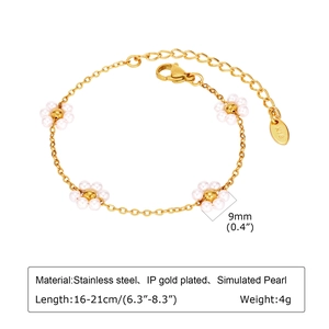 Detail showing gold plated stainless steel bracelet with white pearl flowers and size info