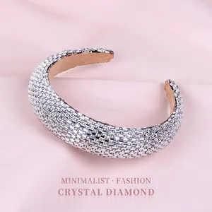 Padded rhinestone headband in Baroque style featuring white crystals on silk background