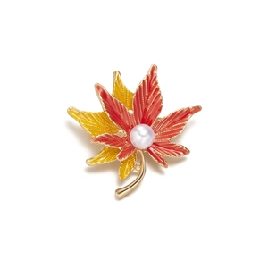 Enameled maple leaf brooch pin with red gradient finish and white pearl accent