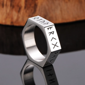 Macro shot of Viking rune ring with hexagonal structure and brushed steel finish