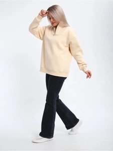 Detail of beige half-zip sweatshirt with oversized fit and high stand collar for women